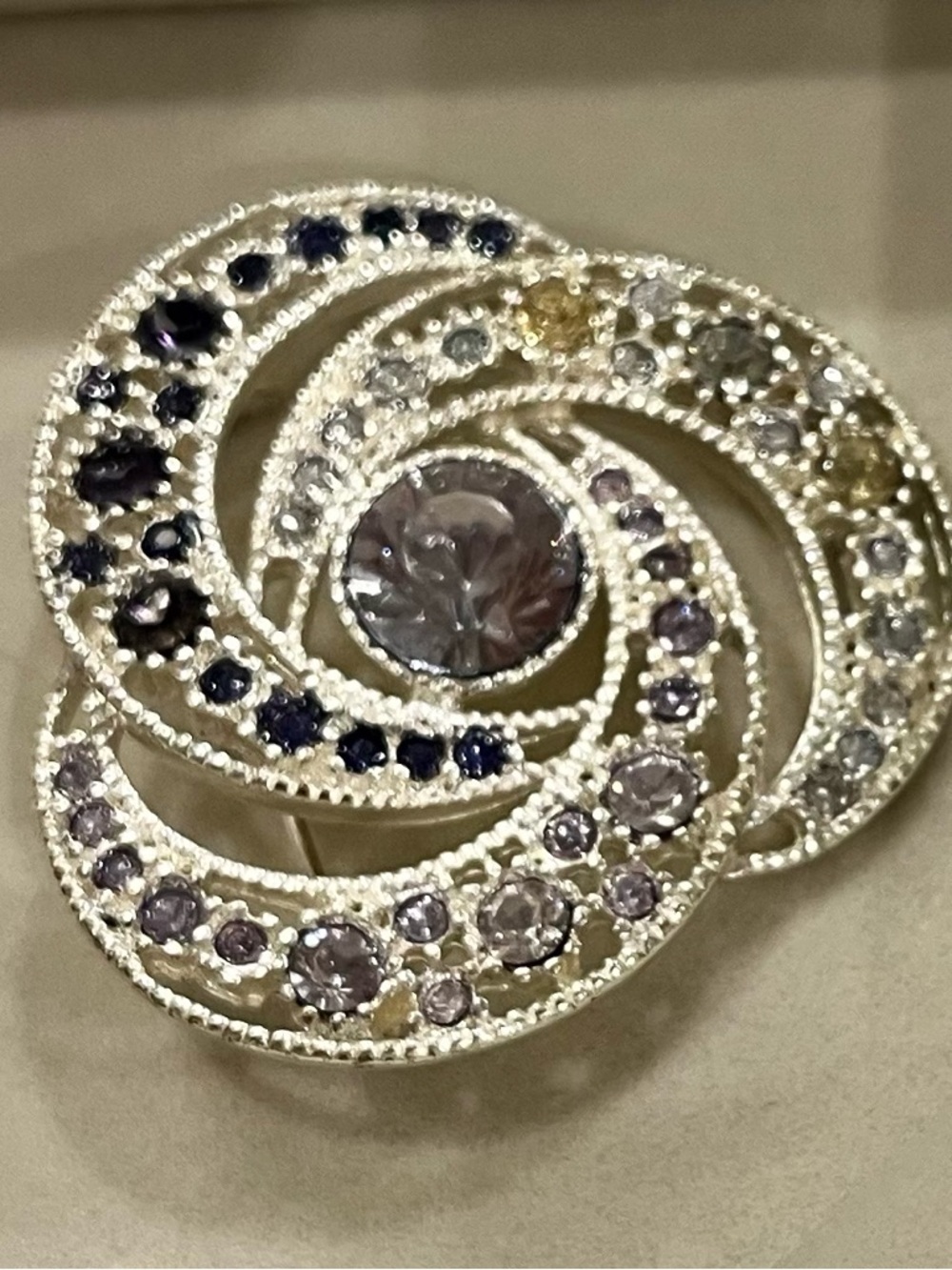 Elegant, Silver-tone Brooch with an array of brilliant crystals.